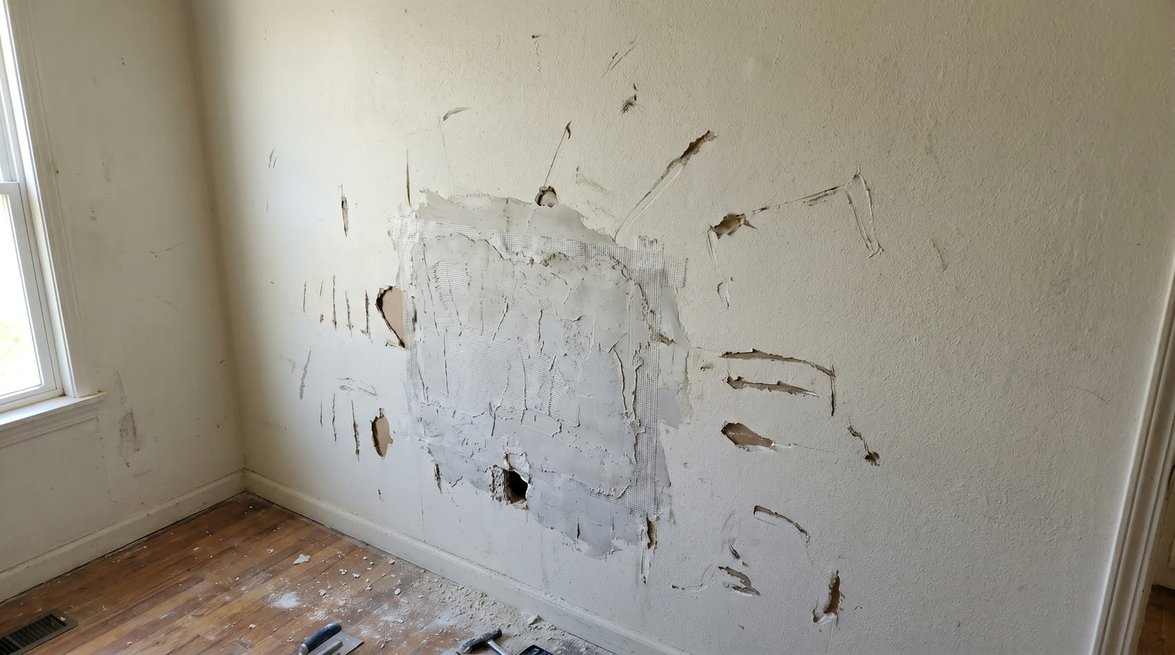 Gouged wall with rough patch